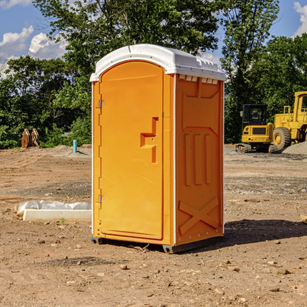 what is the cost difference between standard and deluxe porta potty rentals in Harned